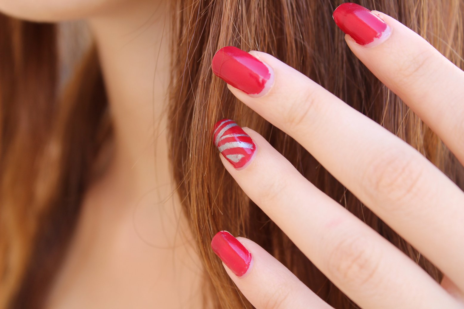 Woman with Red Nail Polish